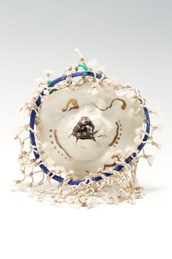 Ceramic sculpture, fishing net debris with shells